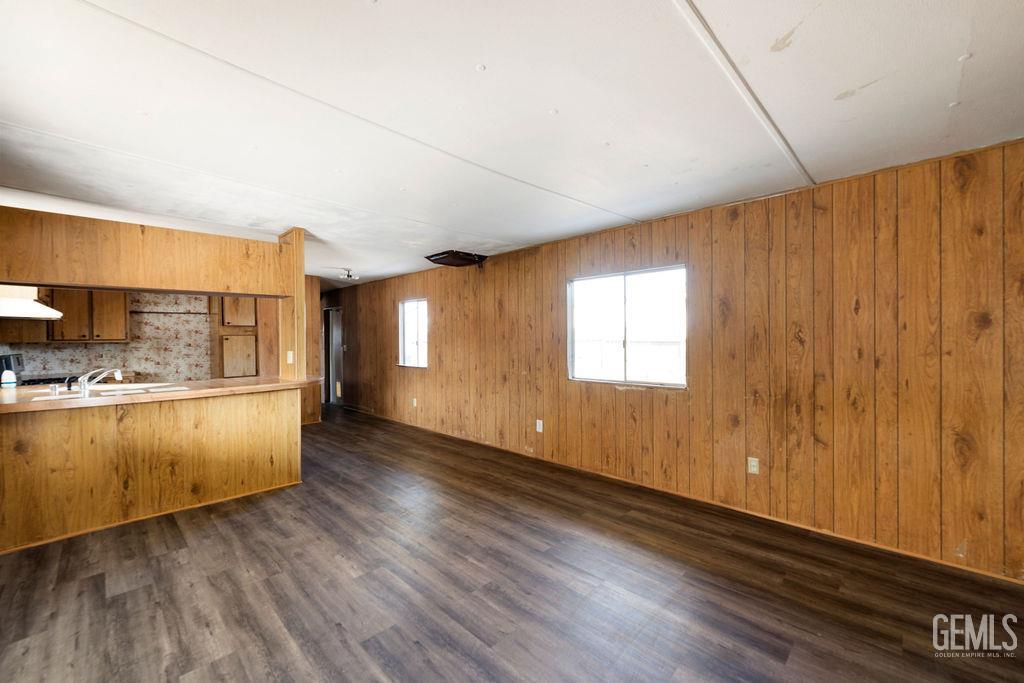 Undisclosed Address Bakersfield, CA 93313 - Photo 6 of 15 a view of a kitchen with wooden floor