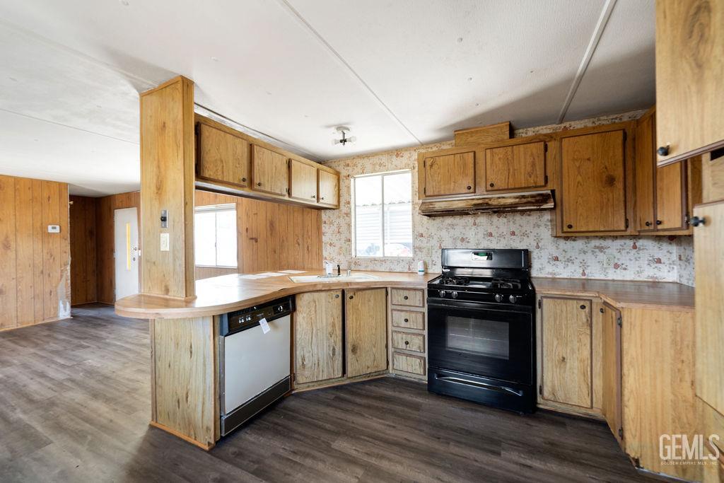 Undisclosed Address Bakersfield, CA 93313 - Photo 8 of 15 a kitchen with stainless steel appliances granite countertop a stove and a sink