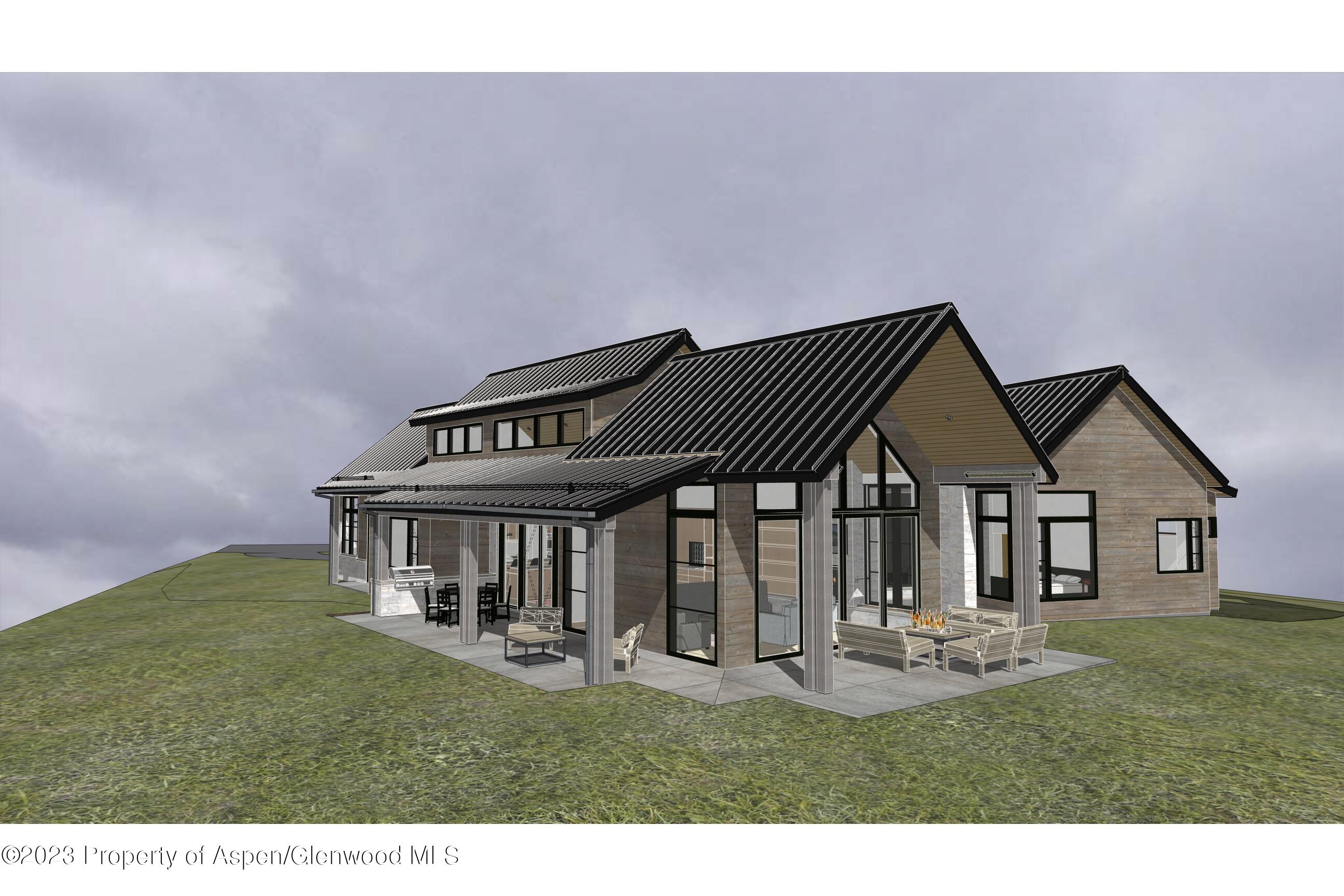 0 Midland Loop Carbondale, CO 81623 - Photo 4 of 13 a front view of a house with a garden and porch