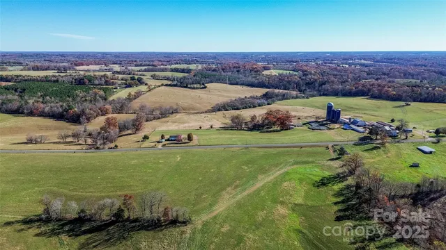 an aerial view of residential houses and outdoor space