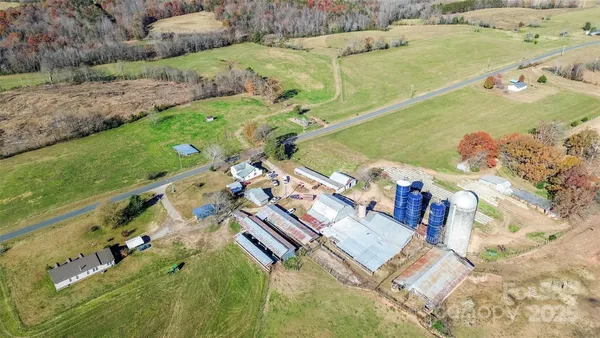 an aerial view of a house with a ocean view