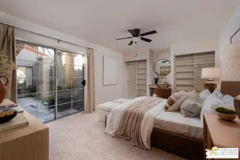 a bedroom with a bed and a mirror