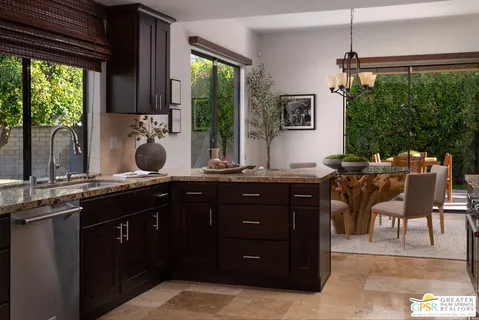 a kitchen with a sink and wooden cabinets