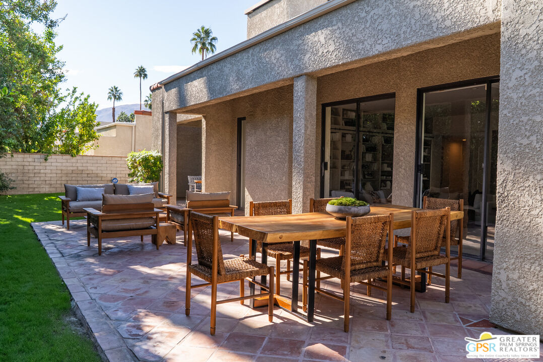 15 Estrella Street Rancho Mirage, CA 92270 - Photo 33 of 37 a view of a patio with table and chairs and potted plants