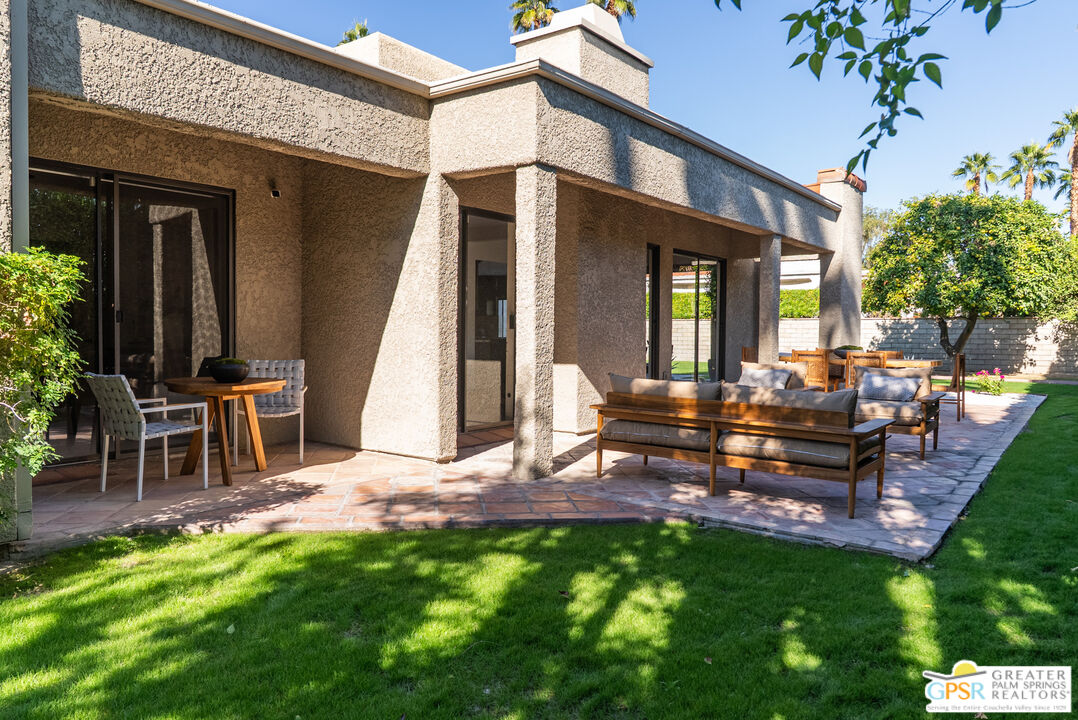 15 Estrella Street Rancho Mirage, CA 92270 - Photo 34 of 37 a view of a patio with table and chairs and potted plants
