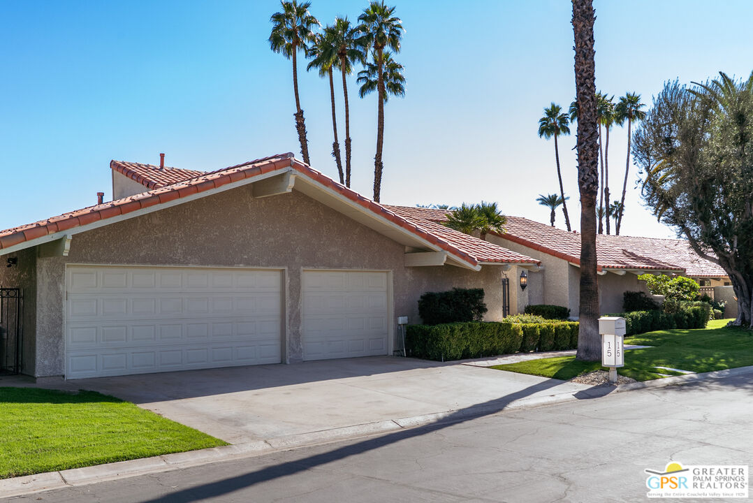 15 Estrella Street Rancho Mirage, CA 92270 - Photo 35 of 37 a view of a house with a yard and palm trees