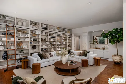 a living room with furniture and a table