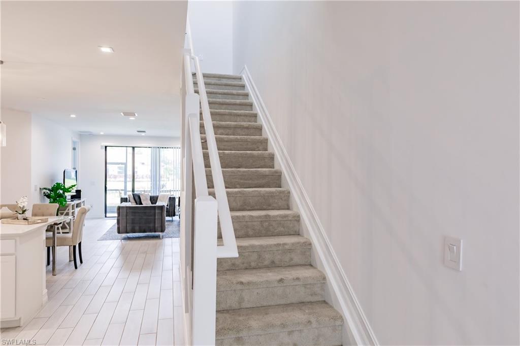 7536 Carnegie Way Naples, FL 34119 - Photo 13 of 23 a view of entryway and hall with wooden floor
