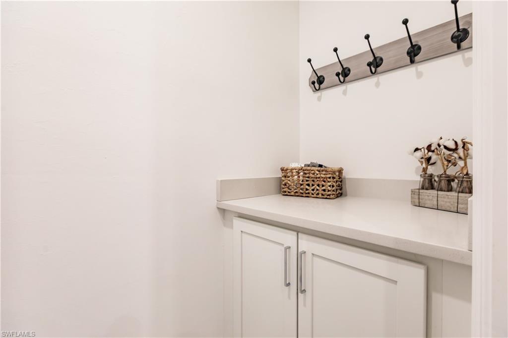 7536 Carnegie Way Naples, FL 34119 - Photo 9 of 23 a bathroom with a sink and a mirror