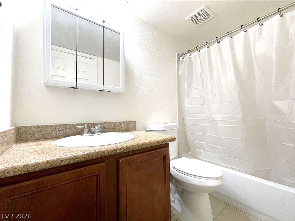 3135 South Mojave Road, Unit 221 Las Vegas, NV 89121 - Photo 12 of 19 Well-maintained bathroom featuring a vanity with ample counter space and a classic tub-shower combination.