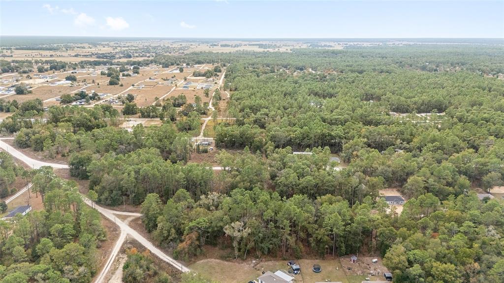 0 Southwest 28th Lane Ocala, FL 34481 - Photo 21 of 23 an aerial view of residential houses with outdoor space and trees