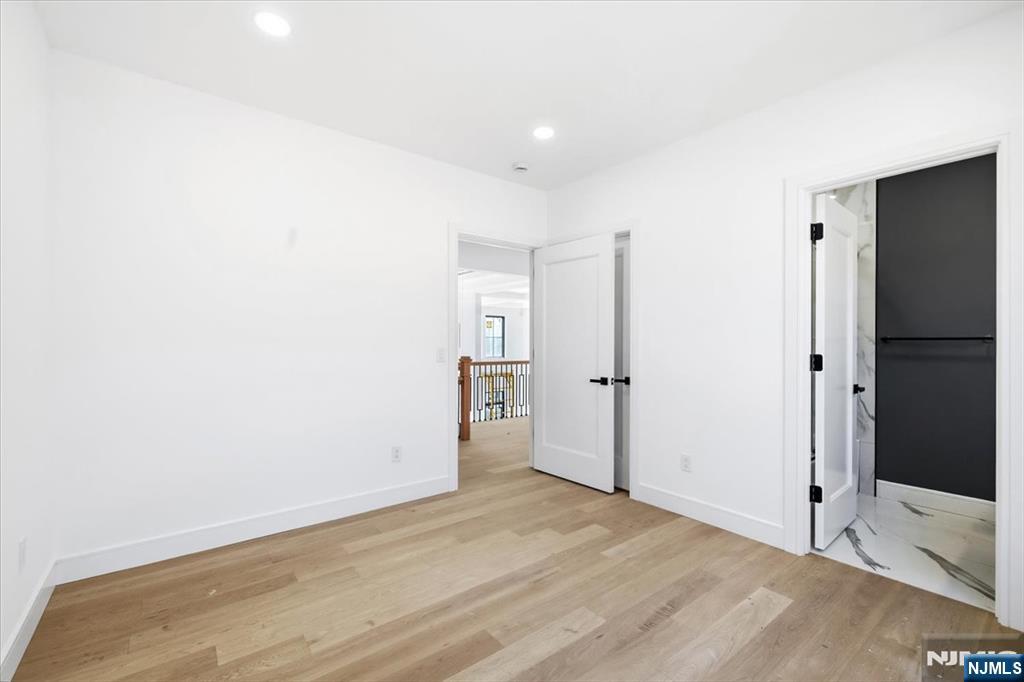 150 Howland Avenue River Edge, NJ 07661 - Photo 22 of 45 a view of empty room with wooden floor