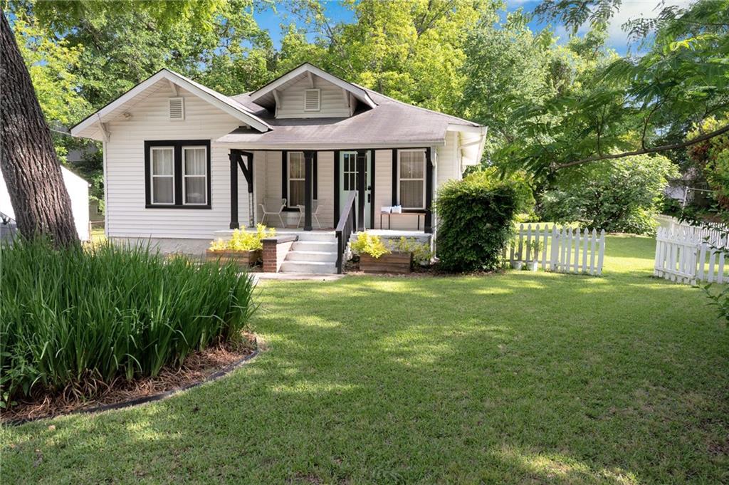 1608 Carroll Drive Northwest Atlanta, GA 30318 - Photo 1 of 43 a front view of a house with a yard and porch