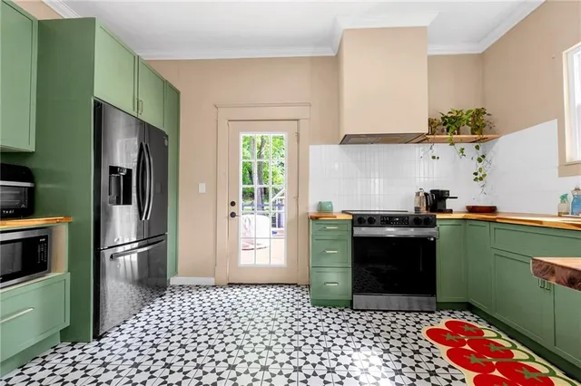 a kitchen with a refrigerator and a sink