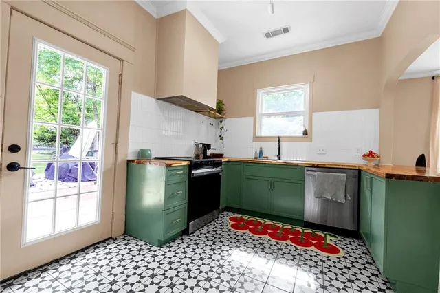 a kitchen with a refrigerator and a stove