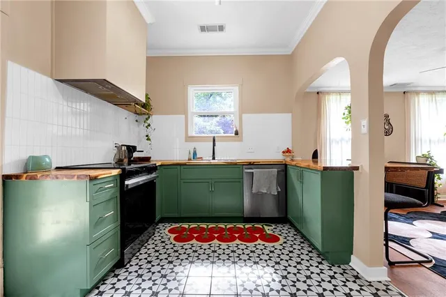 a kitchen with cabinets and window