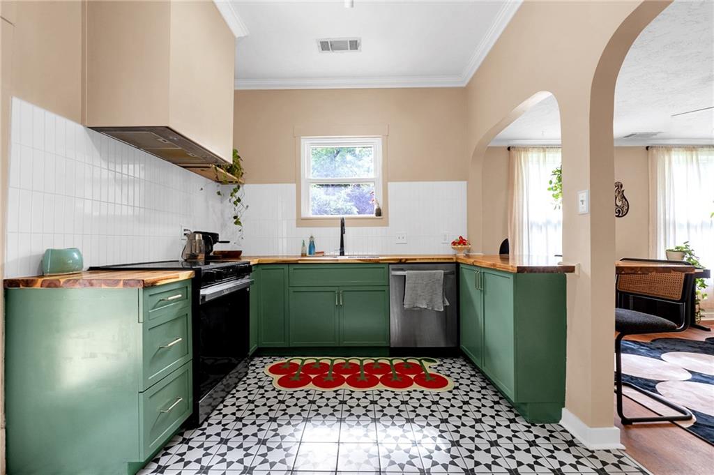 1608 Carroll Drive Northwest Atlanta, GA 30318 - Photo 13 of 43 a kitchen with a refrigerator and a stove