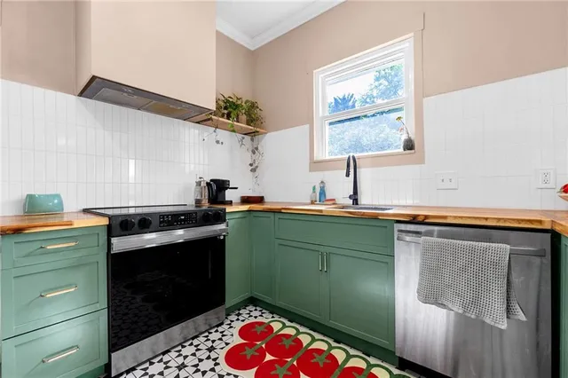 a kitchen with a refrigerator and a sink