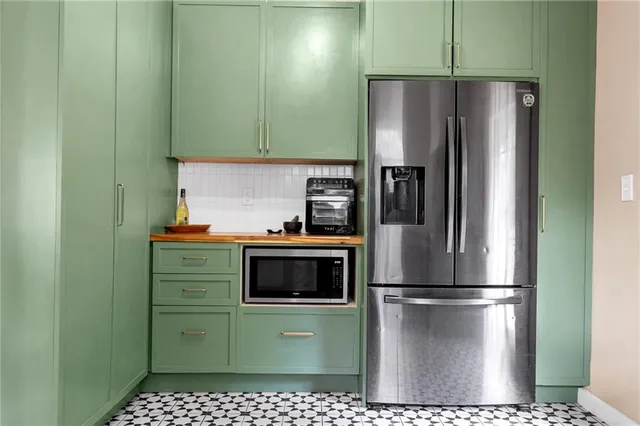 a kitchen with sink and cabinets