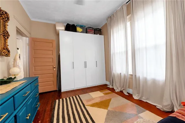 a bathroom with a sink a toilet a tub and a window