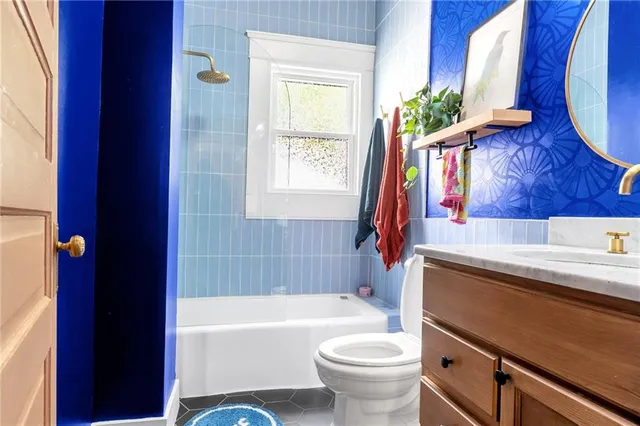 a bathroom with a sink a toilet and a bathtub