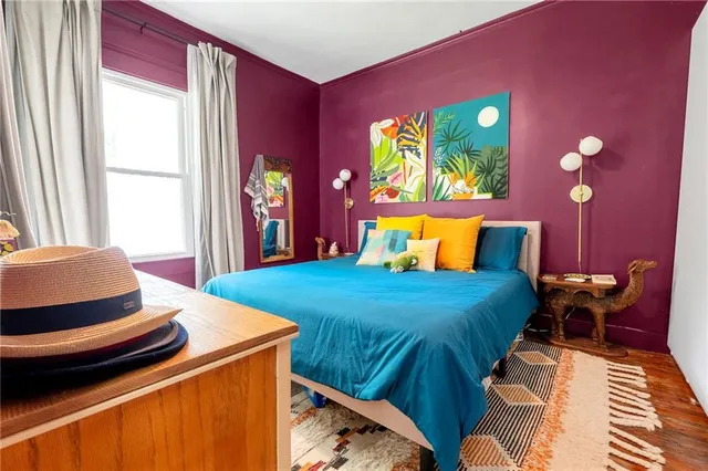 a bedroom with a bed and window