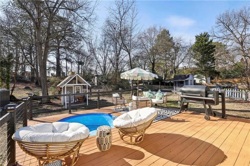 1608 Carroll Drive Northwest Atlanta, GA 30318 - Photo 27 of 43 a view of a house with swimming pool and sitting area