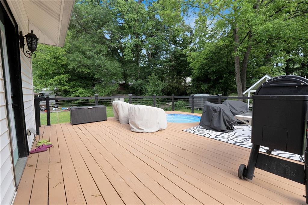 1608 Carroll Drive Northwest Atlanta, GA 30318 - Photo 29 of 43 a view of roof deck with couches wooden floor and fence