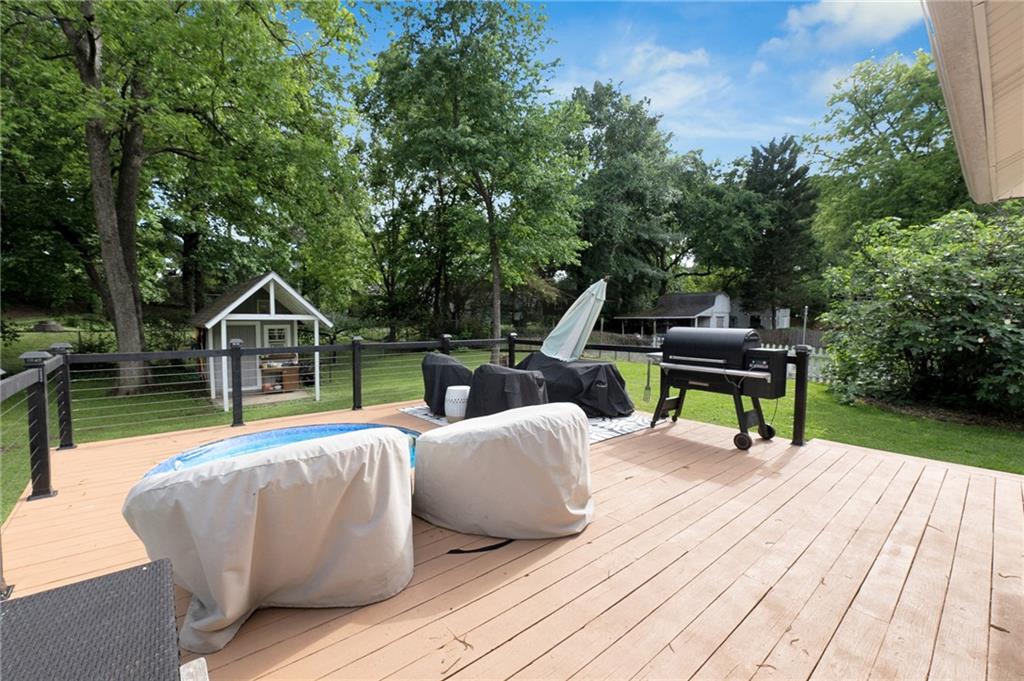 1608 Carroll Drive Northwest Atlanta, GA 30318 - Photo 30 of 43 a wooden bench sitting on top of a wooden floor
