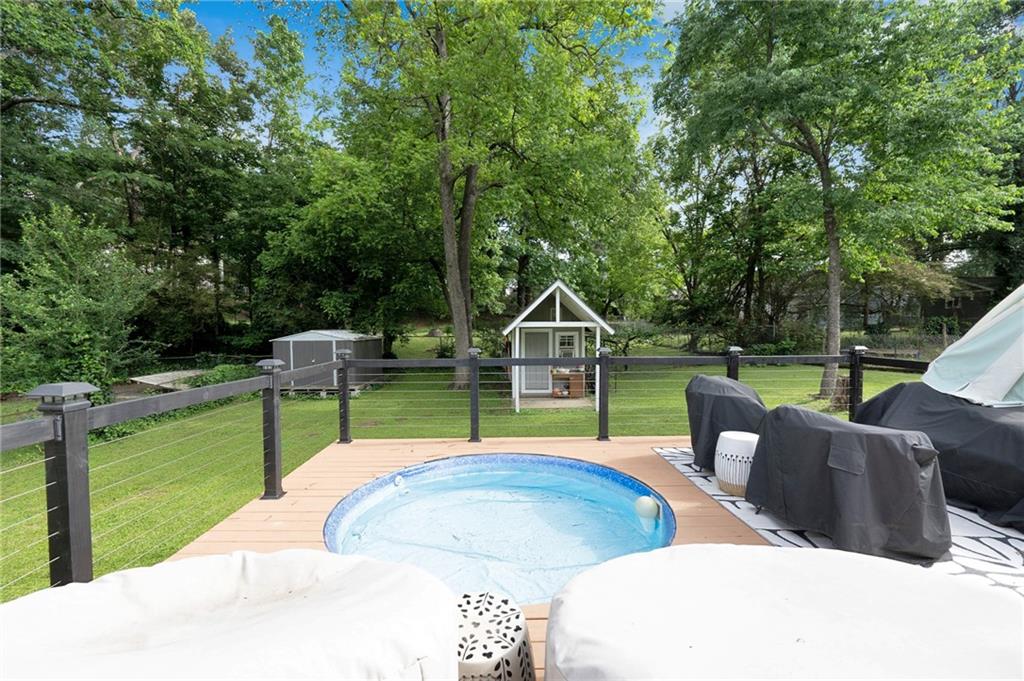 1608 Carroll Drive Northwest Atlanta, GA 30318 - Photo 31 of 43 a view of a backyard with couches chairs and large trees