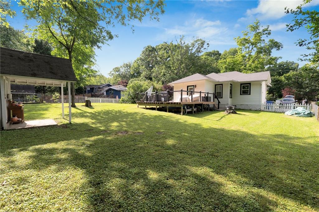 1608 Carroll Drive Northwest Atlanta, GA 30318 - Photo 34 of 43 a view of a house with a big yard and sitting area