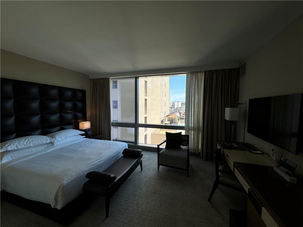 246 Spring Street, Unit 1502 Manhattan, NY 10013 - Photo 15 of 16 Bedroom featuring dark carpet