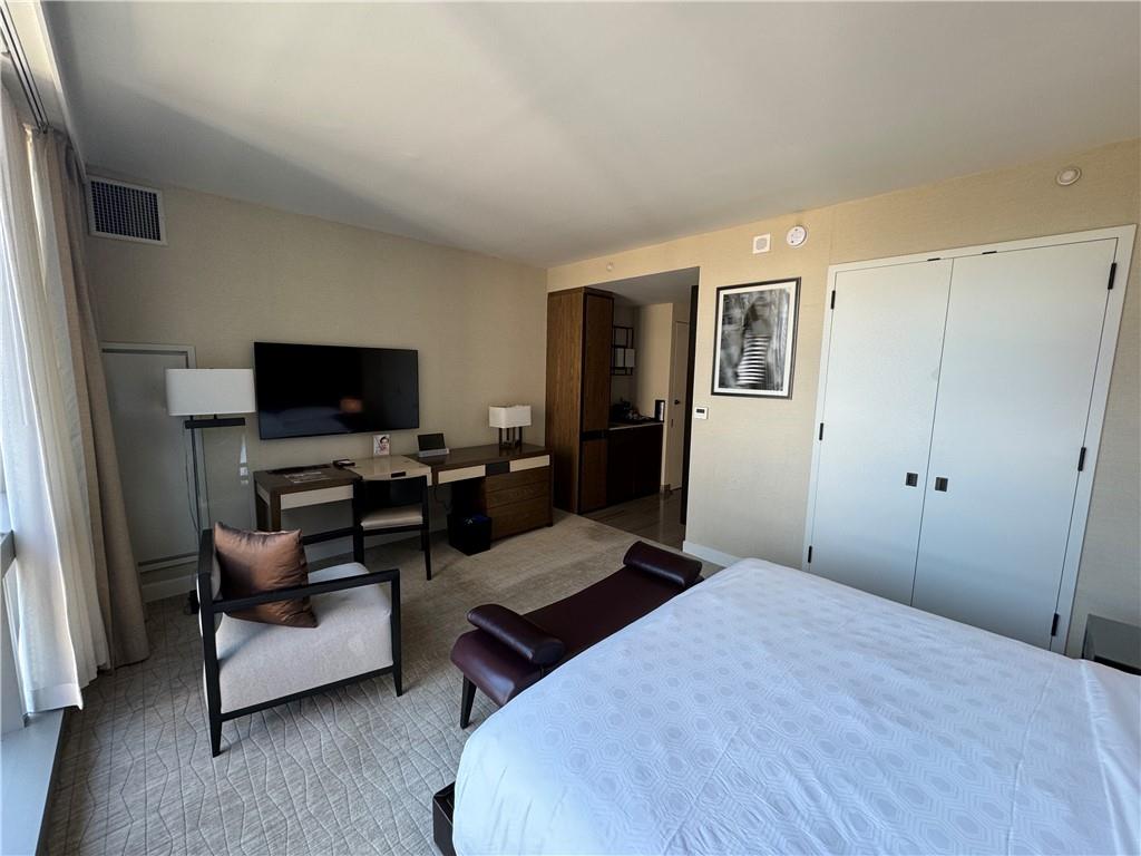 246 Spring Street, Unit 1502 Manhattan, NY 10013 - Photo 10 of 16 Carpeted bedroom with a closet