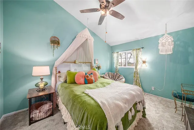 a bedroom with bed and window