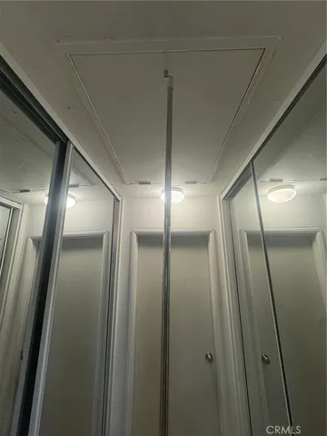 a bathroom with a mirror and a shower