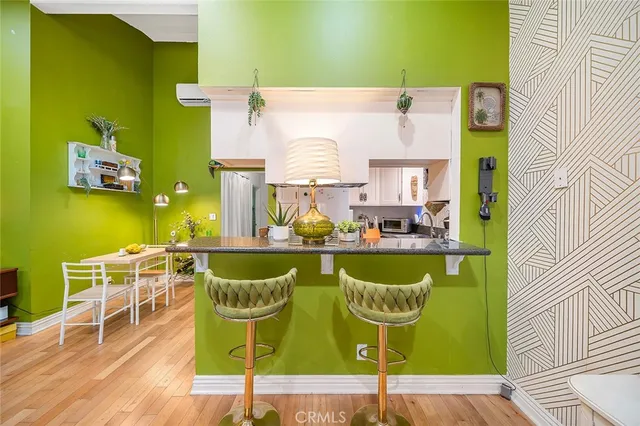 an aerial view of a house with swimming pool and furniture