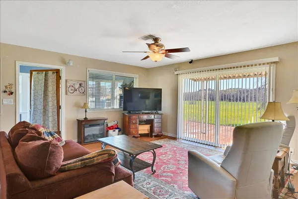 a living room with furniture and a flat screen tv