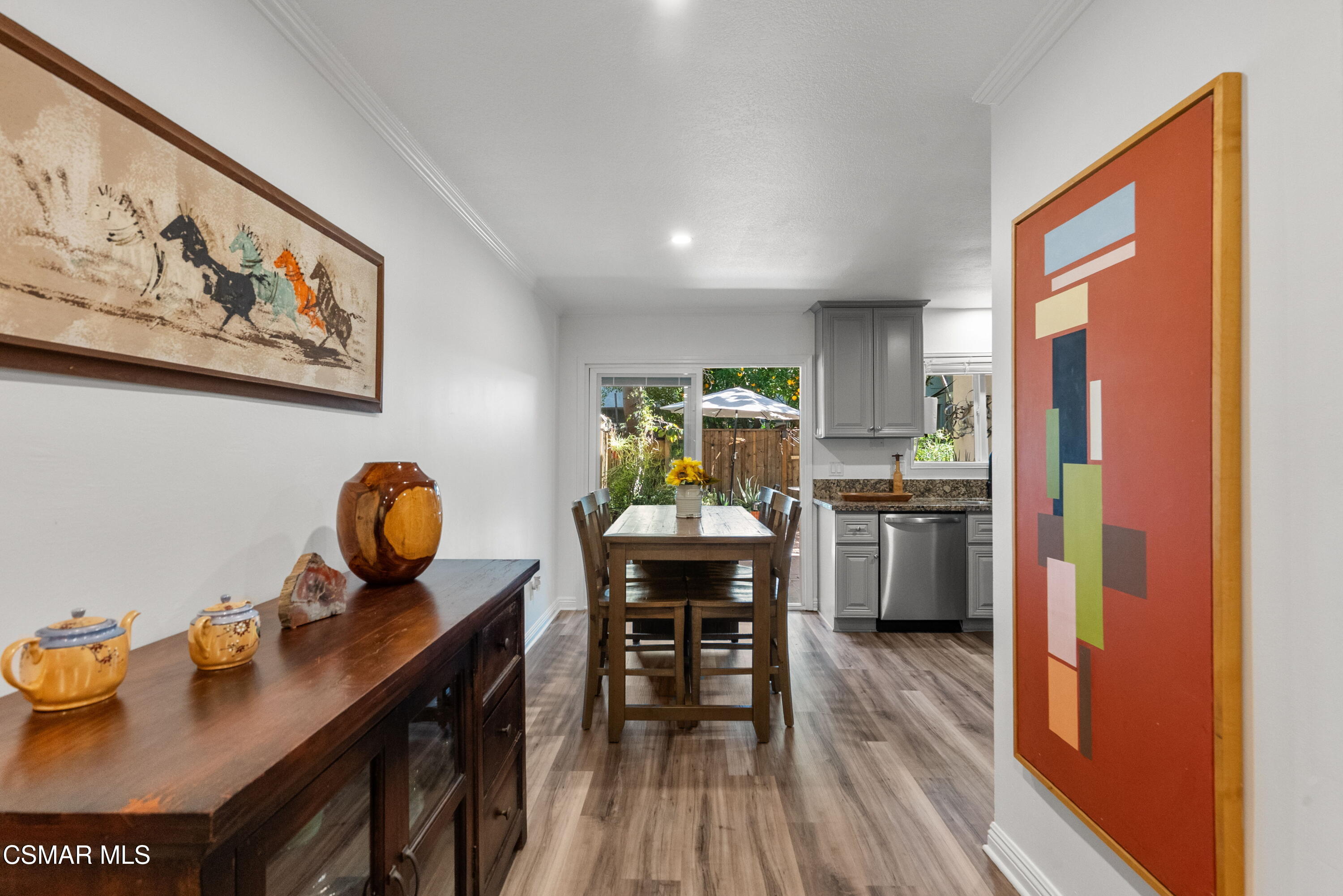 30535 Canwood Street, Unit R58 Agoura Hills, CA 91301 - Photo 4 of 23 a dining room with furniture and wooden floor