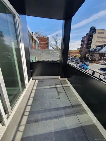 a view of balcony with furniture