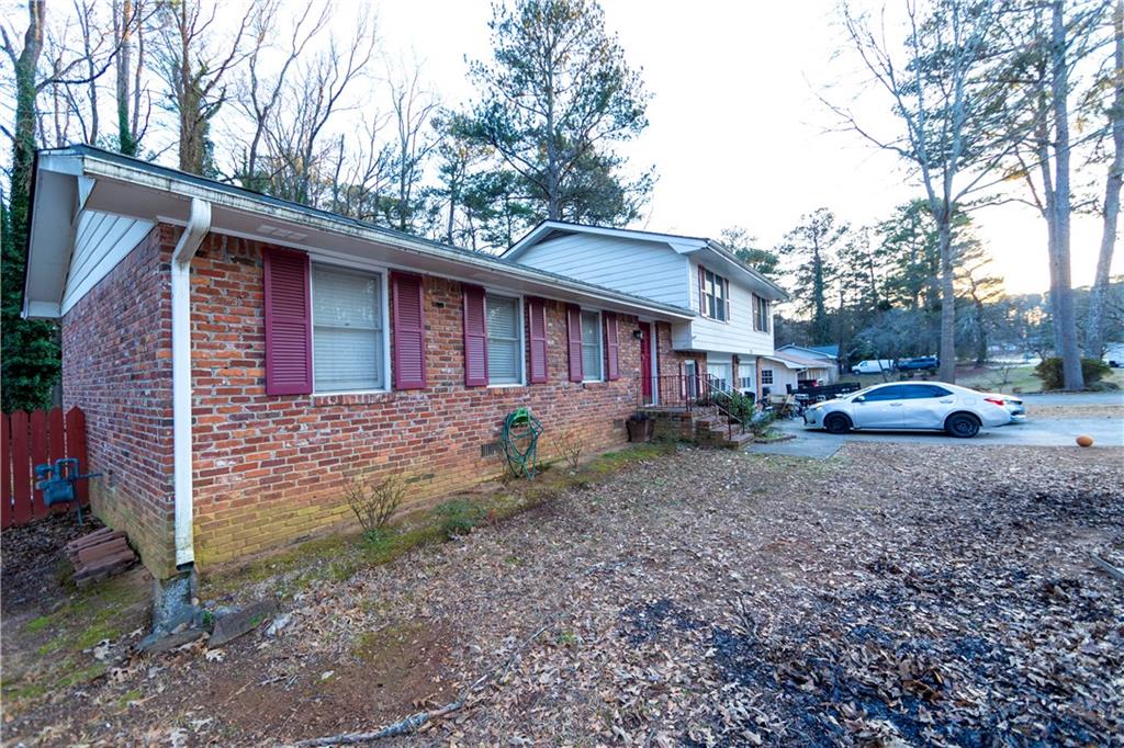775 Shannon Way Lawrenceville, GA 30044 - Photo 1 of 24 a view of a house with a yard