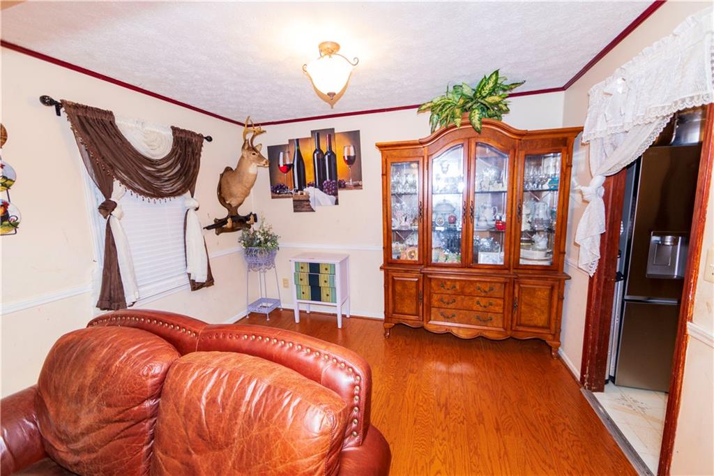 775 Shannon Way Lawrenceville, GA 30044 - Photo 12 of 24 a bedroom with a bed and a chandelier