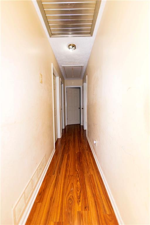 775 Shannon Way Lawrenceville, GA 30044 - Photo 17 of 24 a view of a hallway with wooden floor