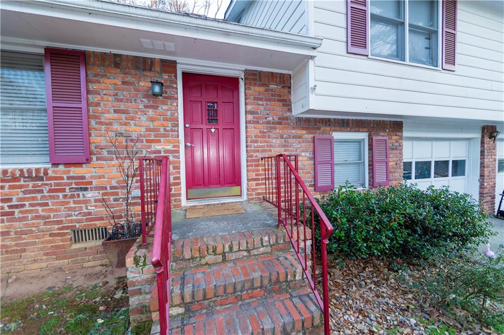 775 Shannon Way Lawrenceville, GA 30044 - Photo 2 of 24 a front view of a house with a porch