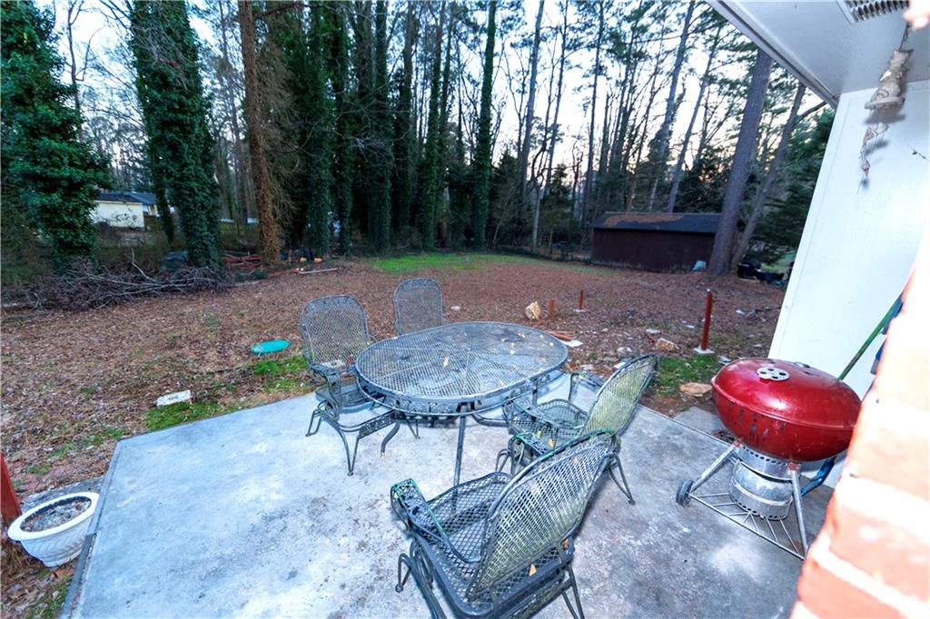 775 Shannon Way Lawrenceville, GA 30044 - Photo 6 of 24 a view of a chairs and table in backyard