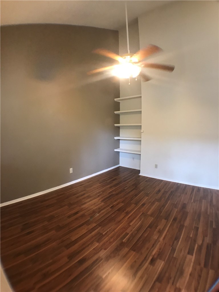 4411 Guadalupe Street, Unit 16 Austin, TX 78751 - Photo 2 of 12 a view of empty room with wooden floor