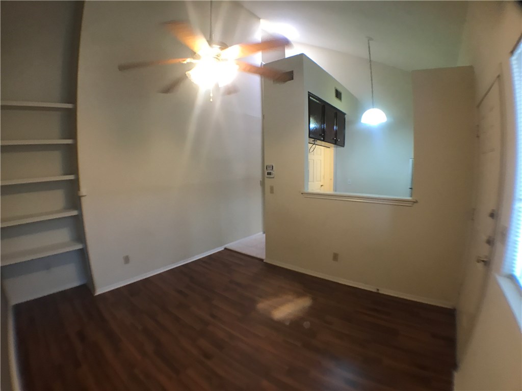 4411 Guadalupe Street, Unit 16 Austin, TX 78751 - Photo 3 of 12 wooden floor in an empty room with a window