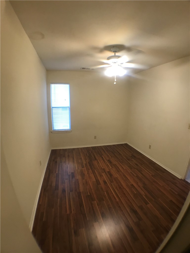 4411 Guadalupe Street, Unit 16 Austin, TX 78751 - Photo 7 of 12 a view of empty room with wooden floor