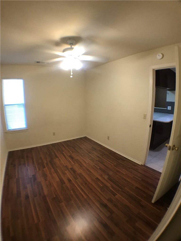 4411 Guadalupe Street, Unit 16 Austin, TX 78751 - Photo 8 of 12 a view of empty room with wooden floor