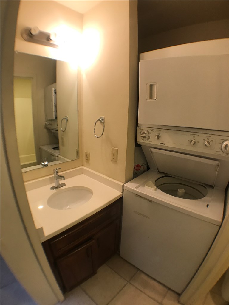 4411 Guadalupe Street, Unit 16 Austin, TX 78751 - Photo 9 of 12 a bathroom with a sink a toilet and mirror