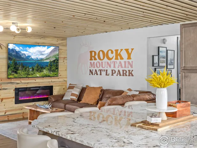 a outdoor living space with furniture and a flat screen tv